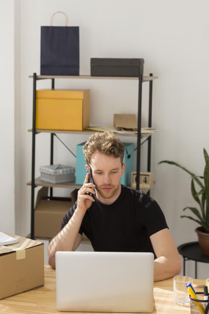 Melbourne business owner on the phone booking a courier