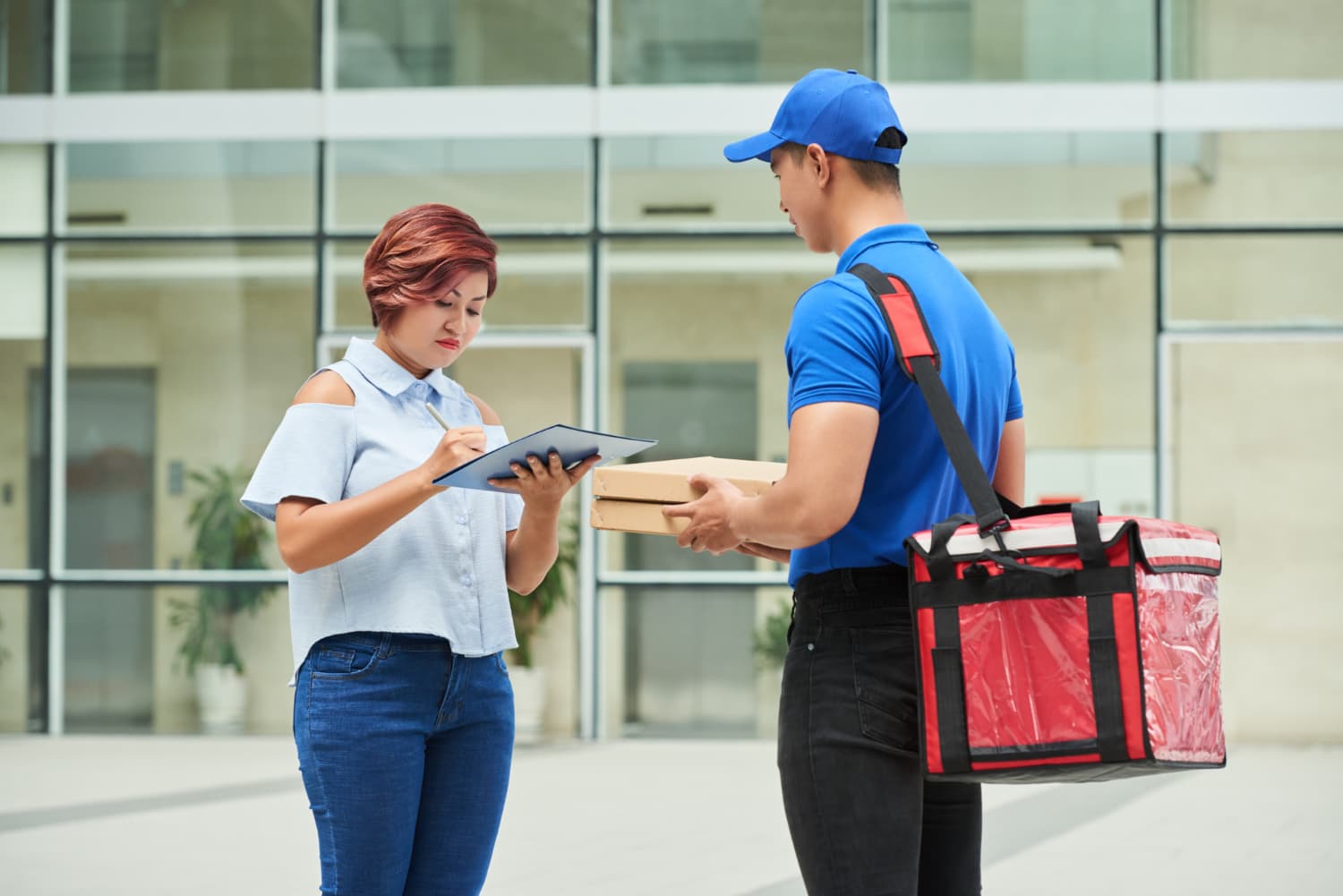 Courier scanning a parcel before delivery