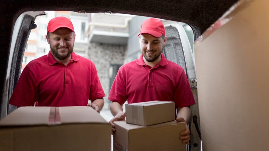 Business team managing multi-carrier shipping
